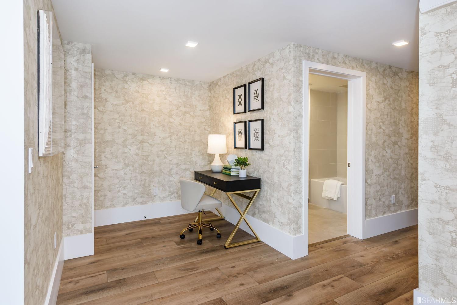 1288 Howard Street, Unit 611 San Francisco, CA 94103 - Photo 10 of 48 a view of a hallway with wooden floor and a living room