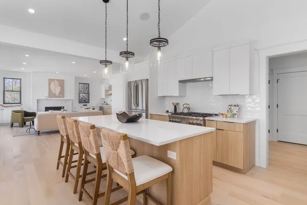an open kitchen with a table and chairs in it