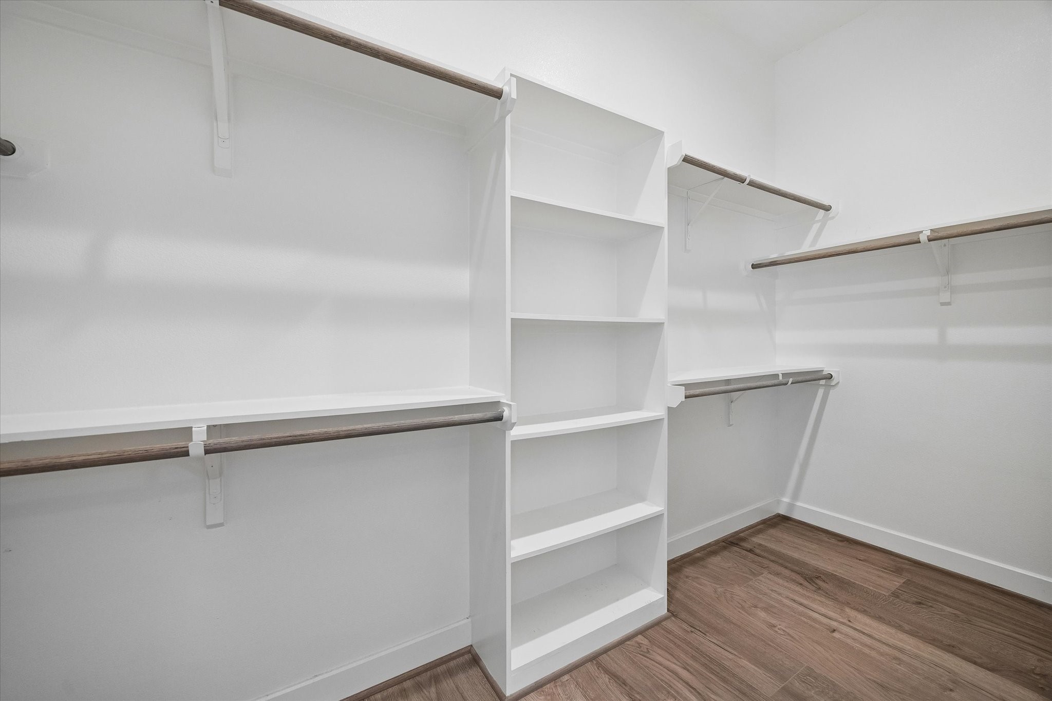 5914 Haring Lane Houston, TX 77091 - Photo 7 of 11 a view of walk in closet with empty racks
