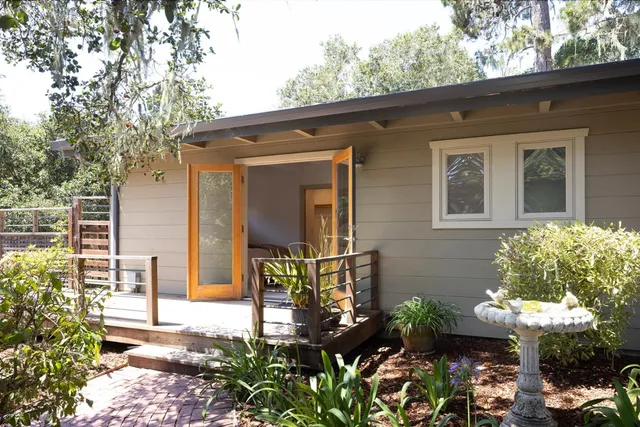 a front view of a house with garden