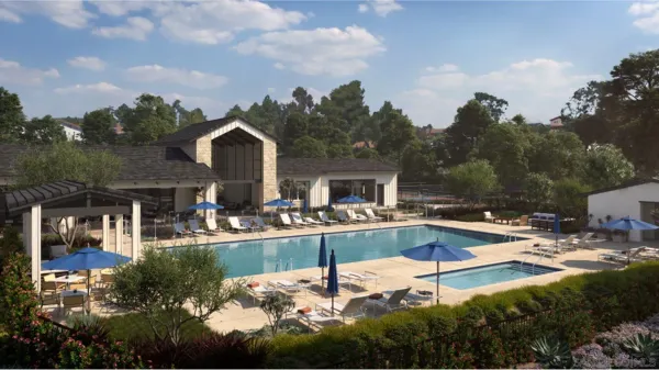 a view of a house with swimming pool and sitting area