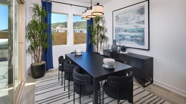a view of a dining room with furniture and window