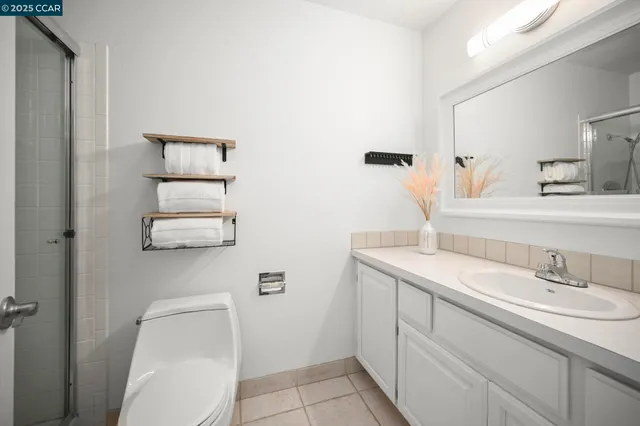 a bathroom with a shower and toilet