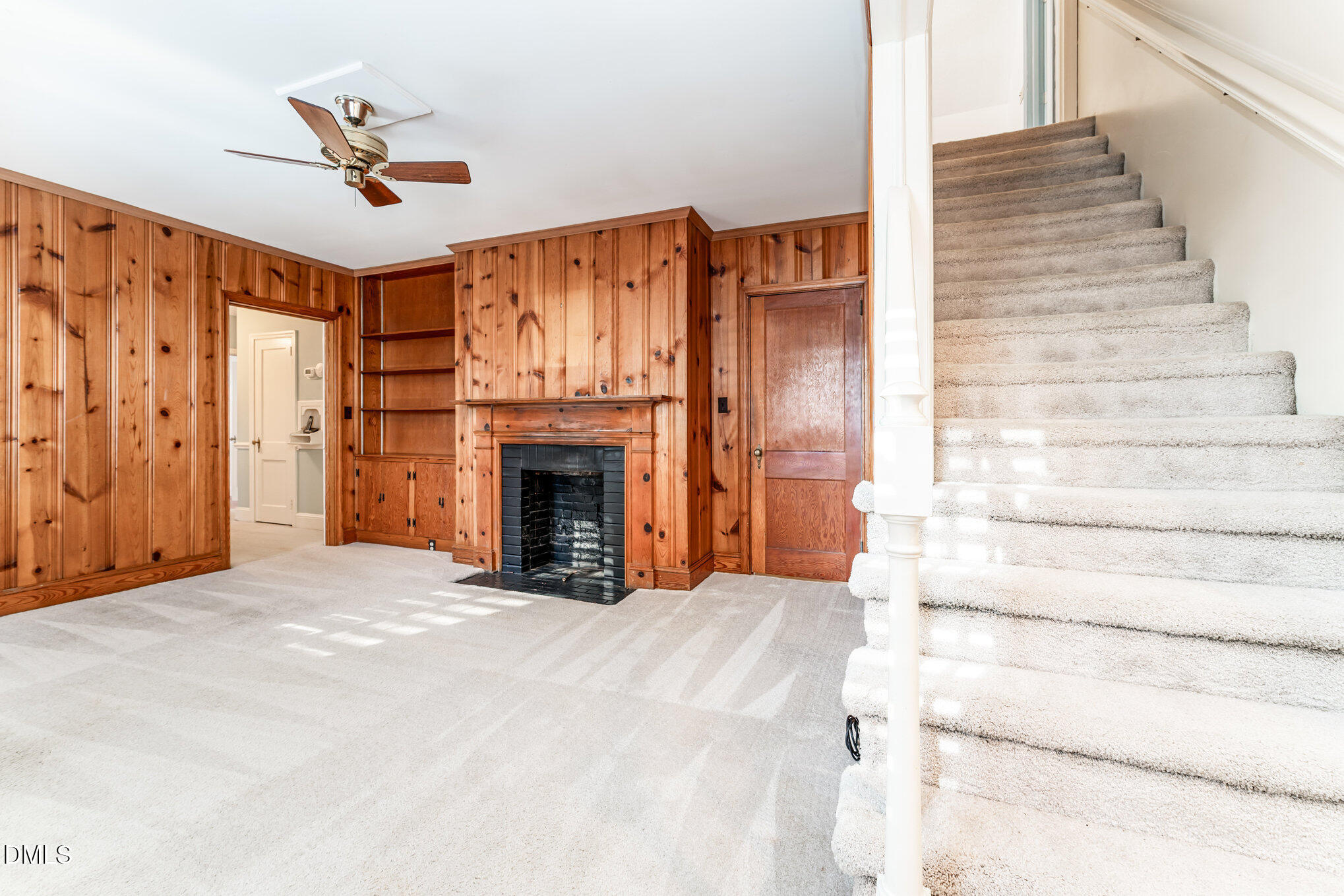 113 West Riverside Drive Smithfield, NC 27577 - Photo 27 of 43 a view of an empty room with fireplace and a window