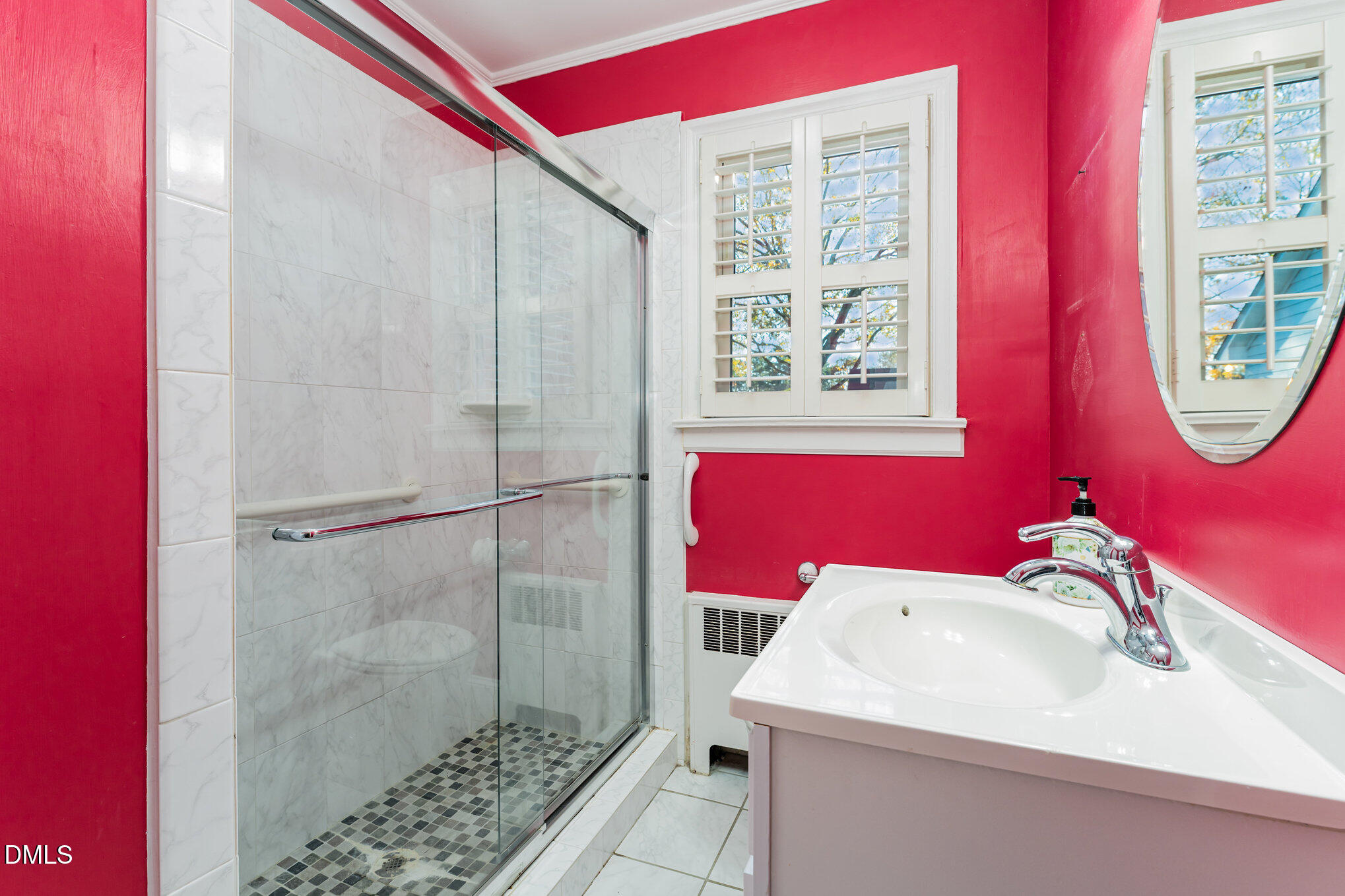 113 West Riverside Drive Smithfield, NC 27577 - Photo 32 of 43 a bathroom with a sink and a mirror