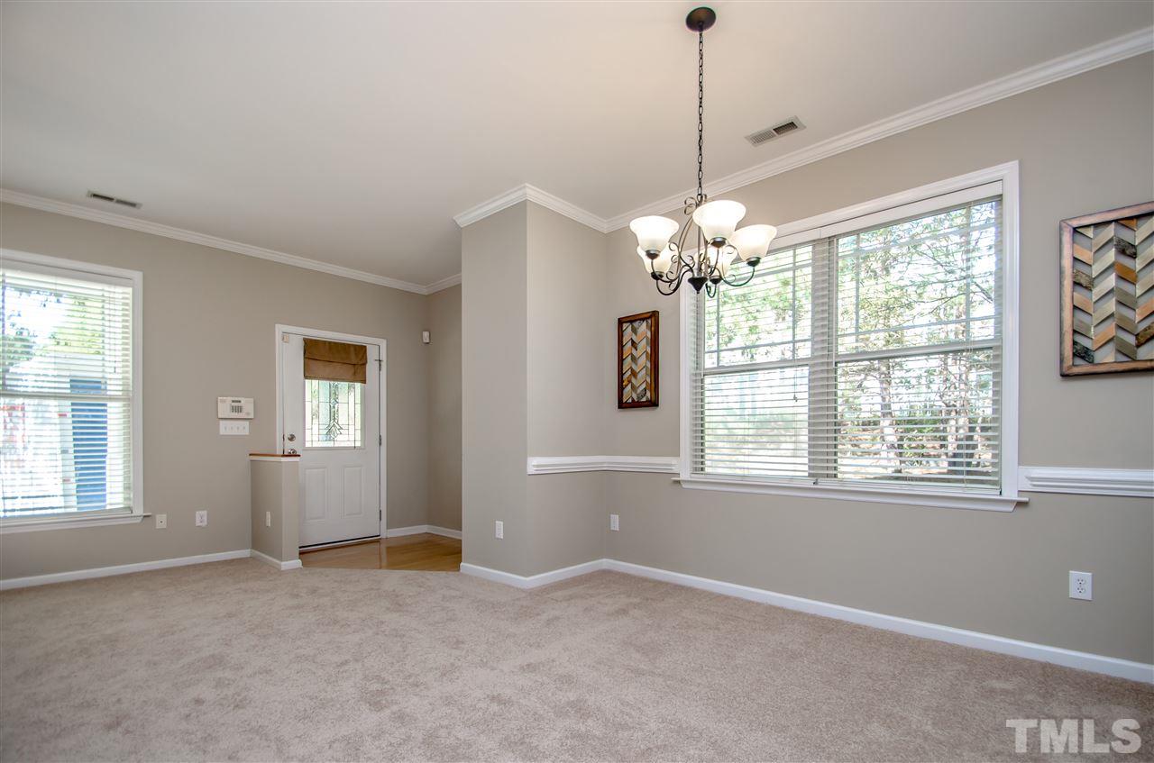 10805 Farmville Road Raleigh, NC 27614 - Photo 3 of 11 The dining area and kitchen are open to the family room which offers a gas FIREPLACE and plenty of windows for NATURAL LIGHTING.