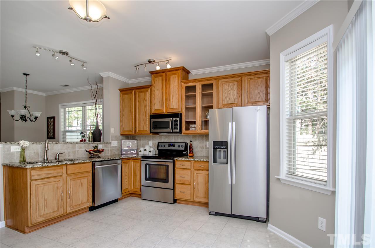 10805 Farmville Road Raleigh, NC 27614 - Photo 5 of 11 The open kitchen offers GRANITE counters, STAINLESS STEEL appliances, breakfast bar, and WALK IN PANTRY. 42 inch cabinets offer plenty of storage!!