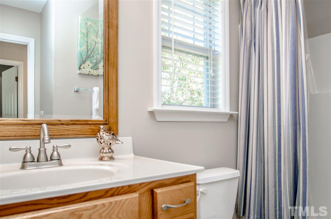 10805 Farmville Road Raleigh, NC 27614 - Photo 7 of 11 Newly updated guest bath with brushed nickel fixtures and new mirror.