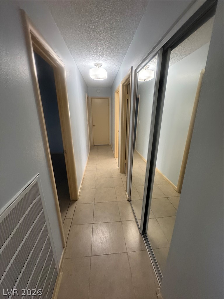 4420 Del Monte Avenue, Unit RENTAL Las Vegas, NV 89102 - Photo 12 of 20 An inviting entry hallway welcomes you with warm lighting and durable tile flooring.