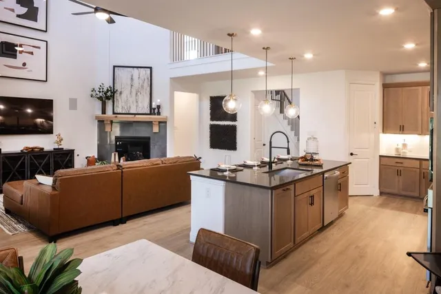 a kitchen with stainless steel appliances granite countertop a stove and a sink