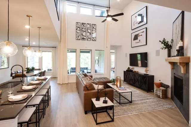 a living room with fireplace furniture and a flat screen tv