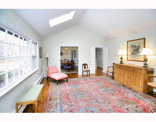 Undisclosed Address Darien, CT 06820 - Photo 4 of 10 a living room with furniture and a wooden floor