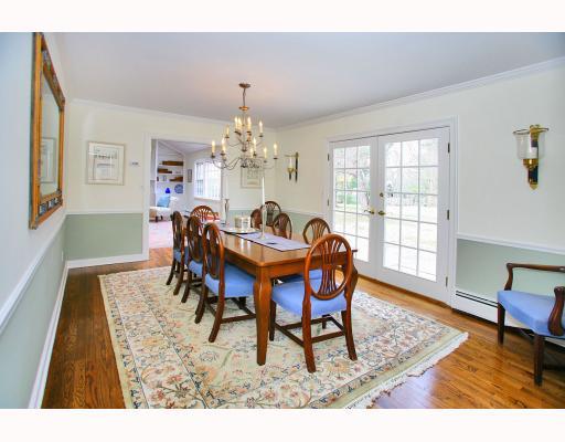 Undisclosed Address Darien, CT 06820 - Photo 5 of 10 a dining room with furniture a rug and wooden floor