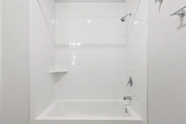 a close up of a bathtub curtain