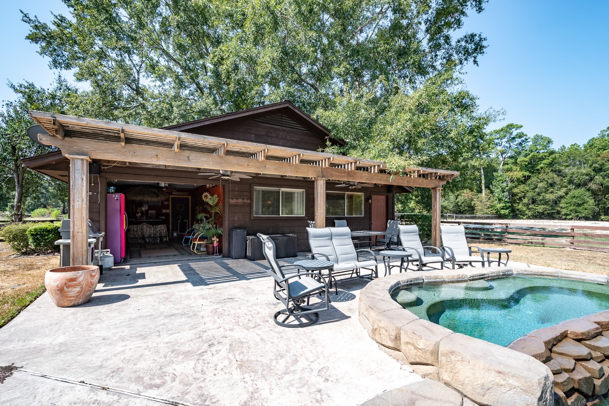 16410 Farm To Market 1485 Conroe, TX 77302 - Photo 20 of 47 a view of a house with porch and furniture