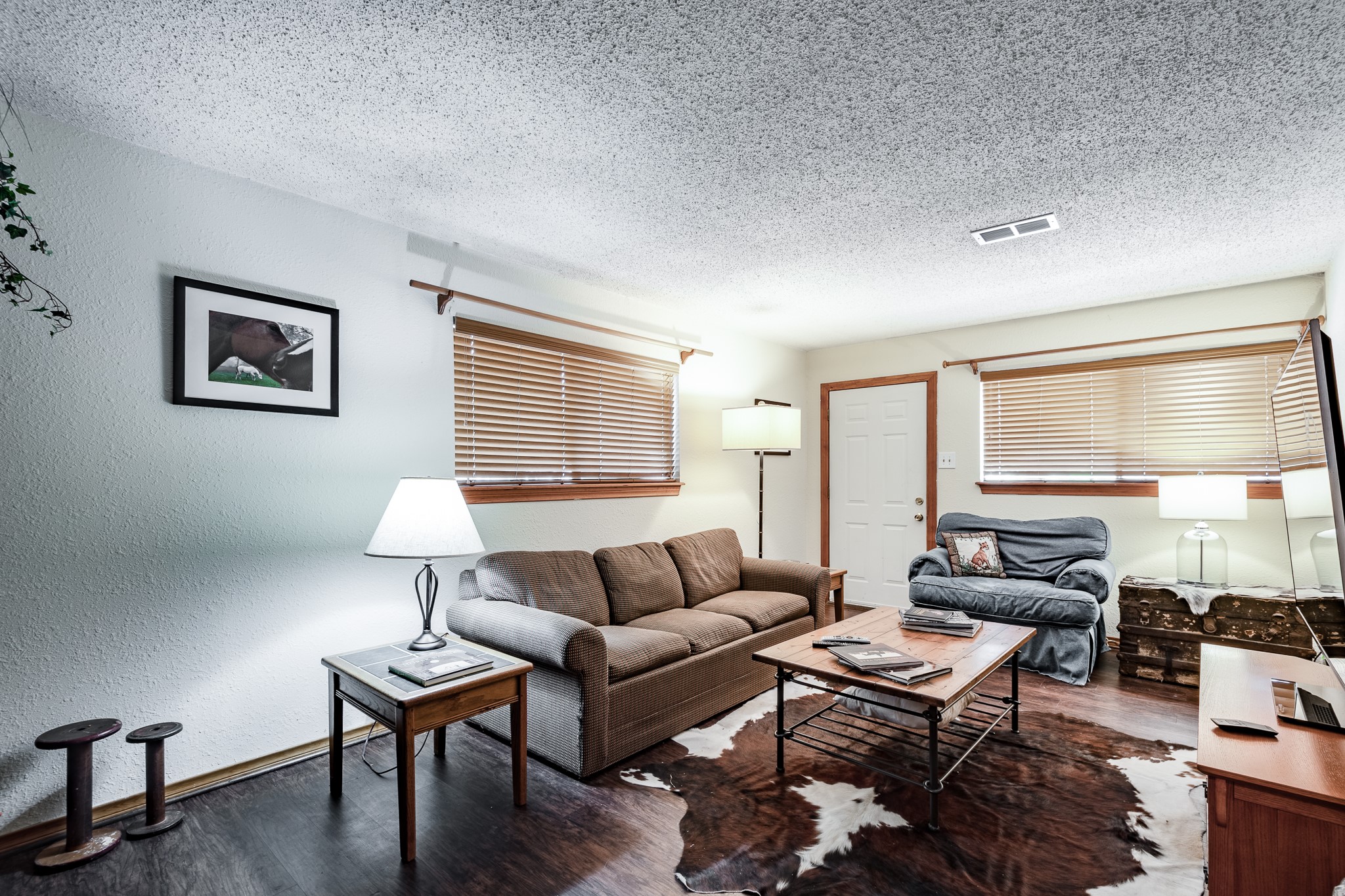 16410 Farm To Market 1485 Conroe, TX 77302 - Photo 24 of 47 a living room with furniture a lamp and a table