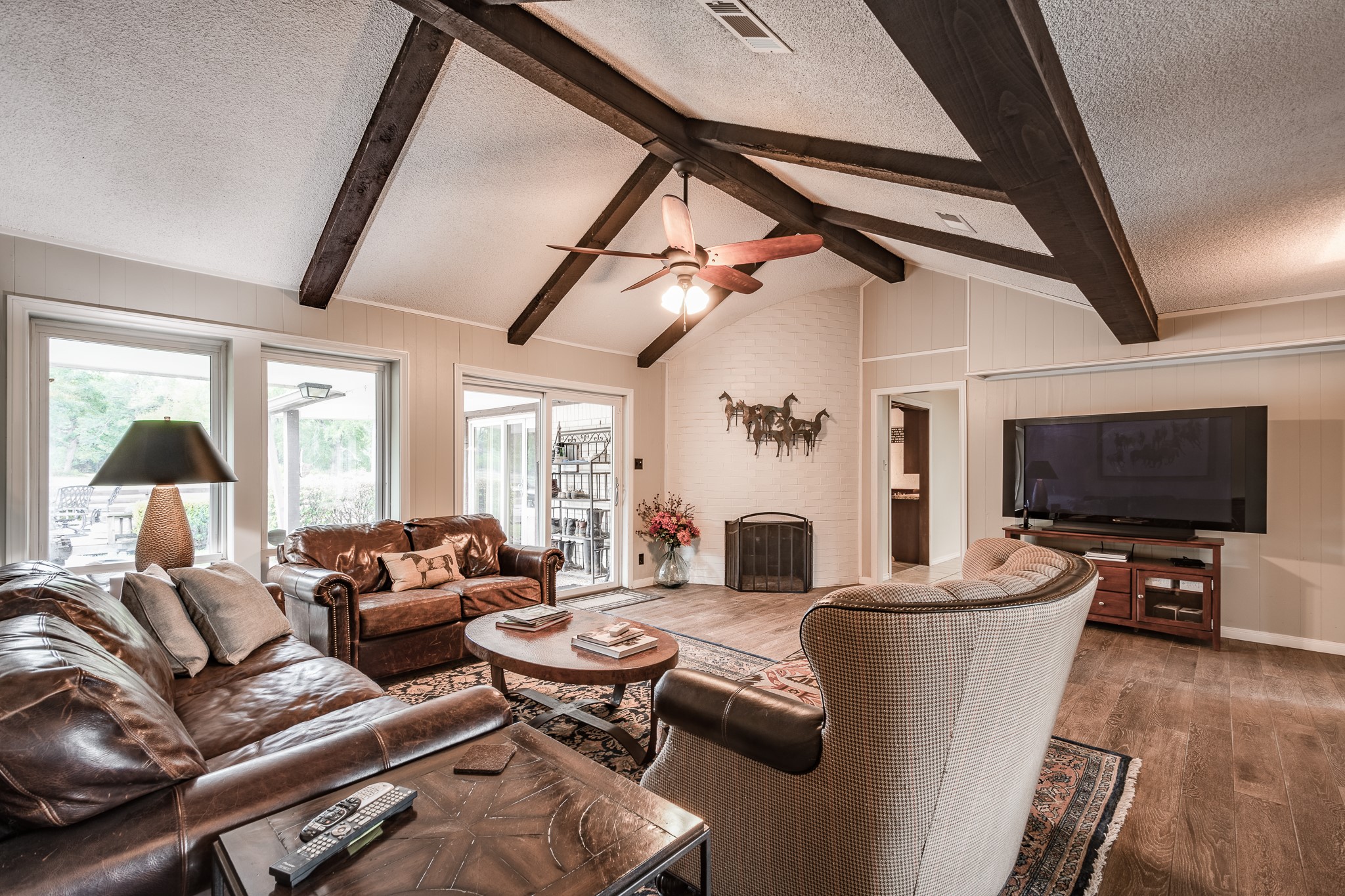 16410 Farm To Market 1485 Conroe, TX 77302 - Photo 31 of 47 a living room with furniture and a flat screen tv