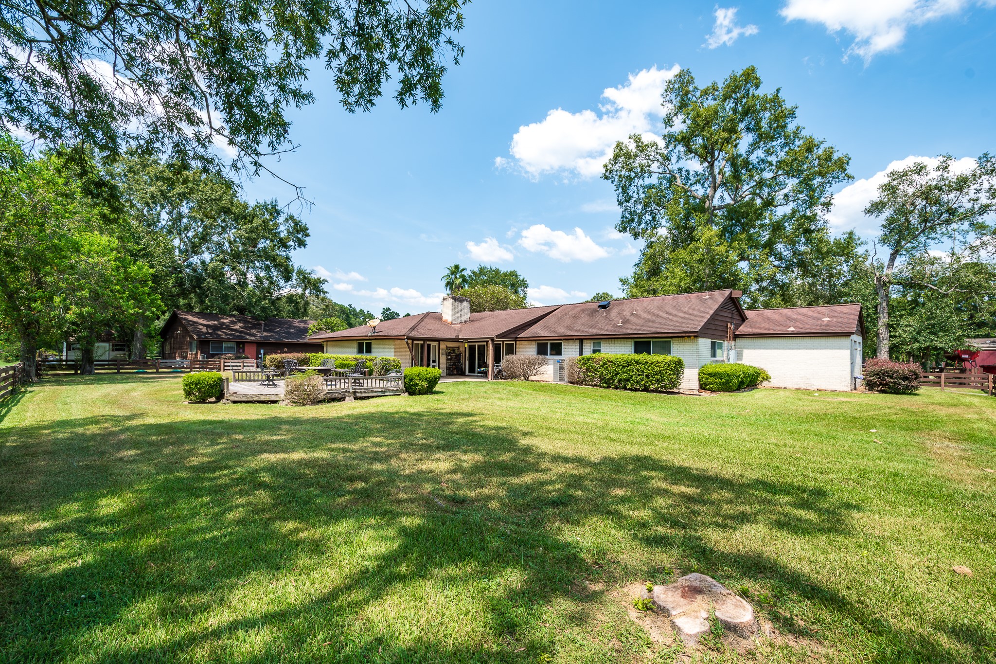 16410 Farm To Market 1485 Conroe, TX 77302 - Photo 4 of 47 a front view of a house with a garden