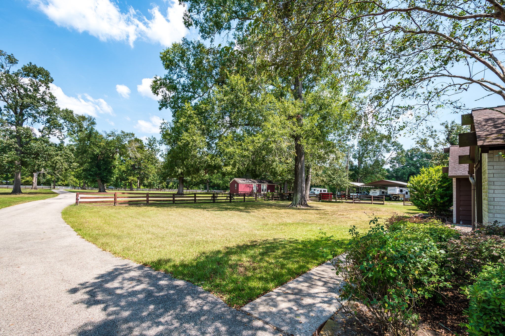 16410 Farm To Market 1485 Conroe, TX 77302 - Photo 45 of 47 a view of a swimming pool with an outdoor space and seating area