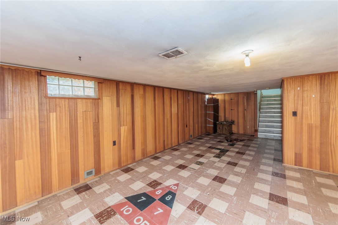 5445 Hauserman Road Cleveland, OH 44130 - Photo 34 of 45 Basement featuring wood walls and light tile patterned floors
