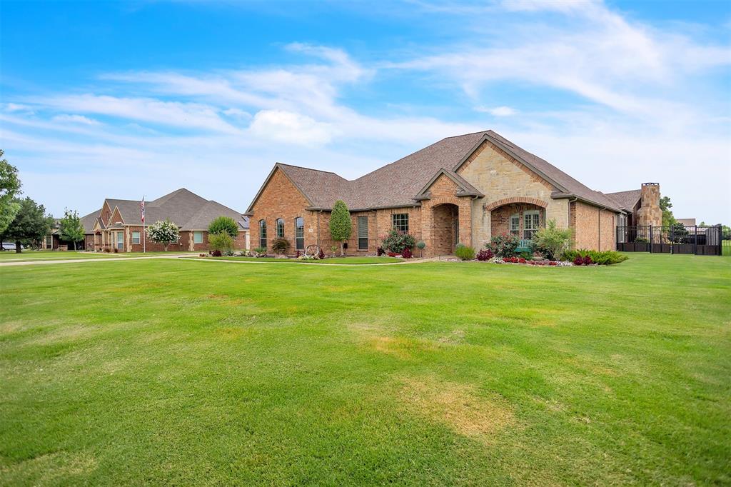 12286 Emerald Ranch Lane North Forney, TX 75126 - Photo 3 of 40 a front view of a house with garden
