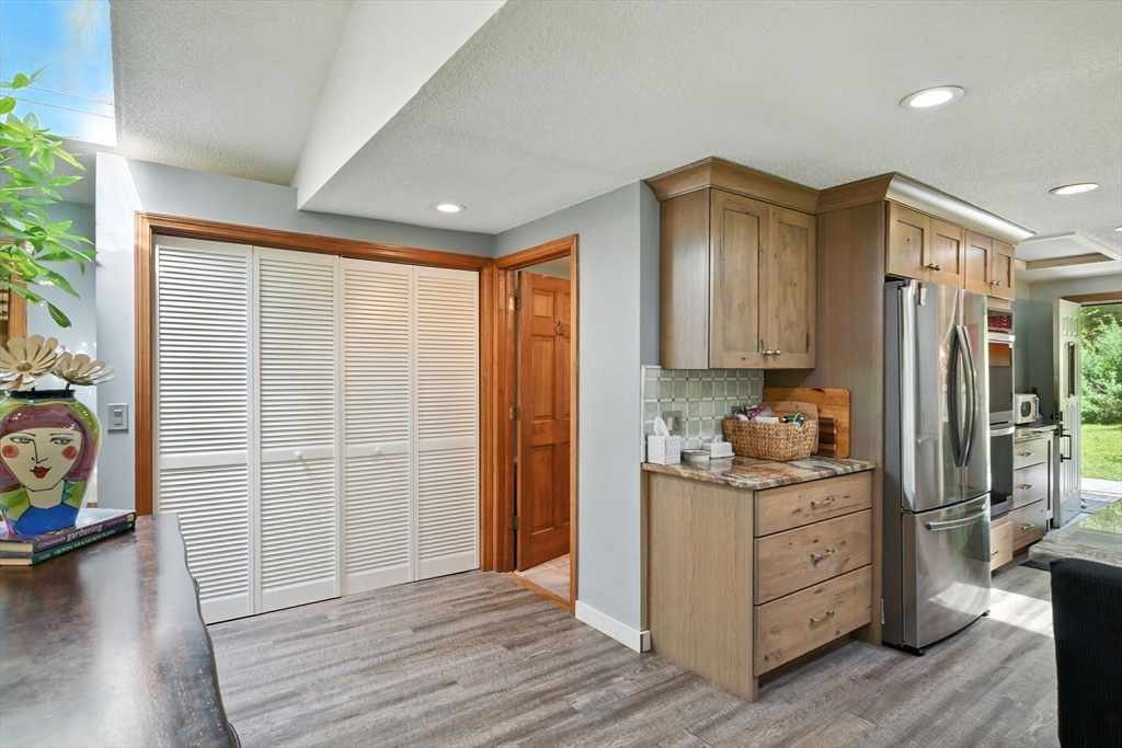 68 Stagecoach Road West Brookfield, MA 01585 - Photo 15 of 40 a view of a kitchen with fridge and wooden floor