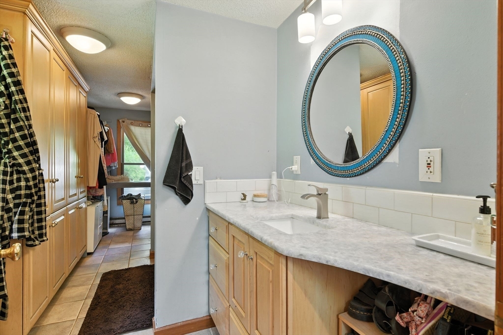 68 Stagecoach Road West Brookfield, MA 01585 - Photo 16 of 40 a bathroom with a granite countertop double vanity sink and a mirror