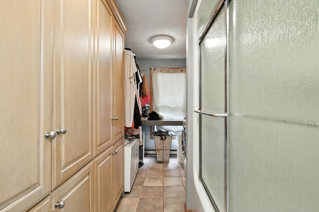 68 Stagecoach Road West Brookfield, MA 01585 - Photo 17 of 40 a view of a hallway with wooden shelves