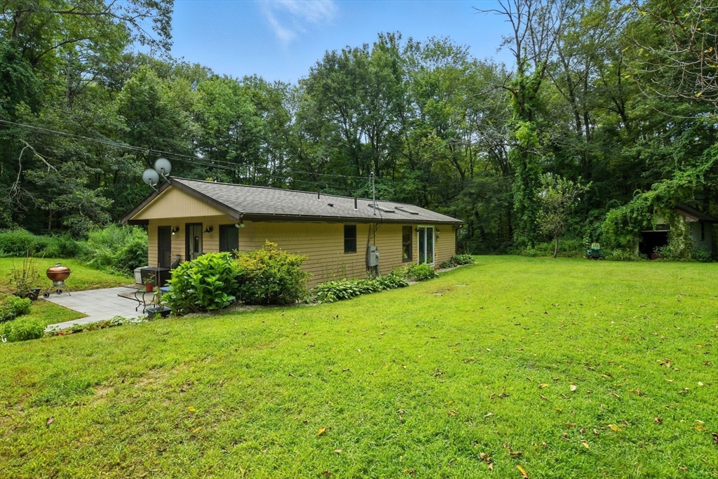 68 Stagecoach Road West Brookfield, MA 01585 - Photo 2 of 40 a front view of a house with yard and green space