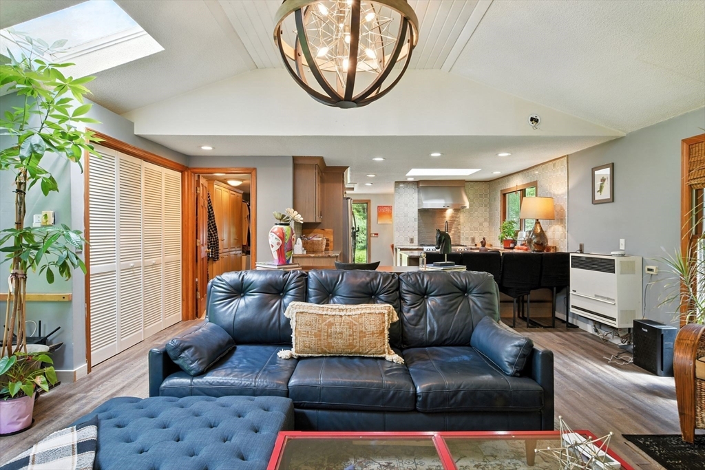 68 Stagecoach Road West Brookfield, MA 01585 - Photo 24 of 40 a living room with furniture a potted plant and a large window