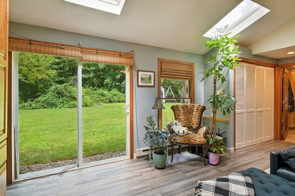 68 Stagecoach Road West Brookfield, MA 01585 - Photo 26 of 40 a living room filled with furniture and a potted plant