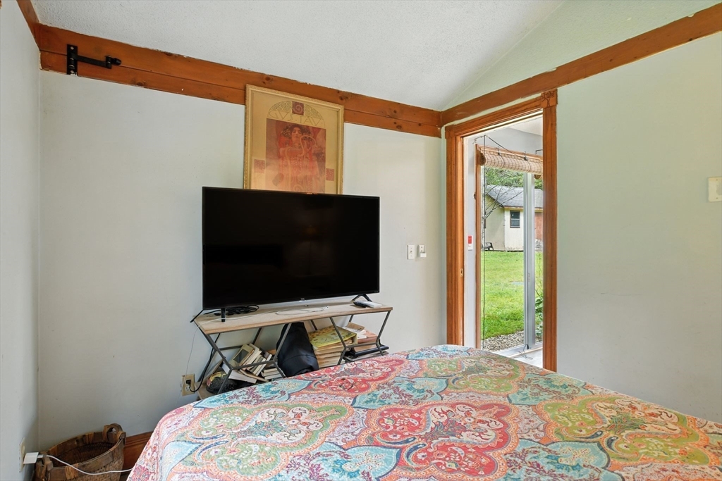 68 Stagecoach Road West Brookfield, MA 01585 - Photo 30 of 40 a bedroom with a bed and a flat screen tv
