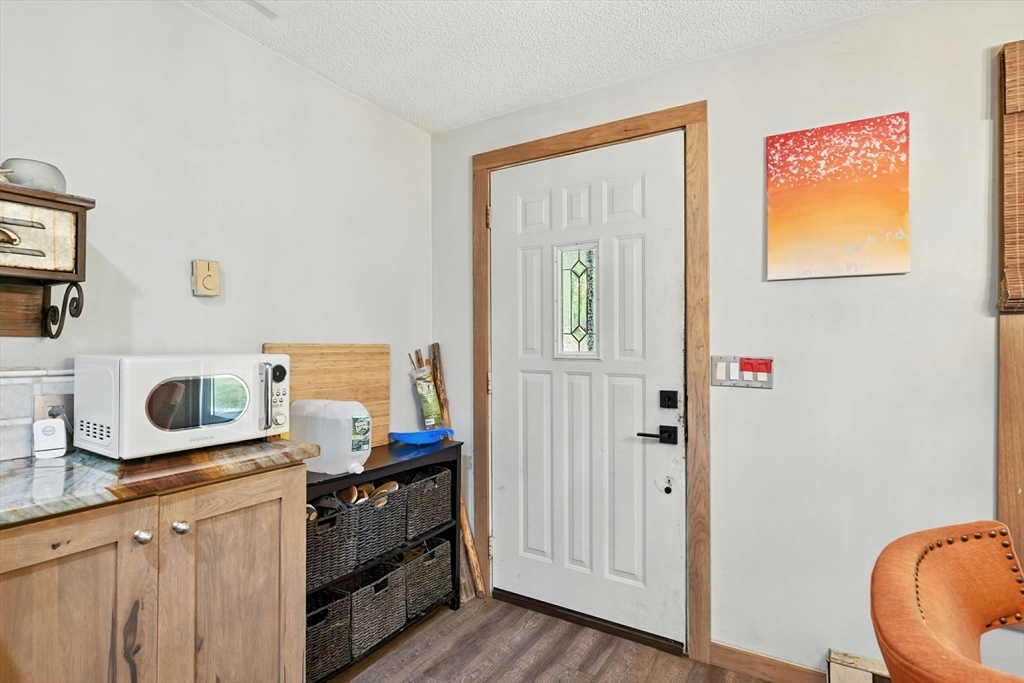 68 Stagecoach Road West Brookfield, MA 01585 - Photo 3 of 40 a kitchen with stainless steel appliances granite countertop a stove and a wooden floor