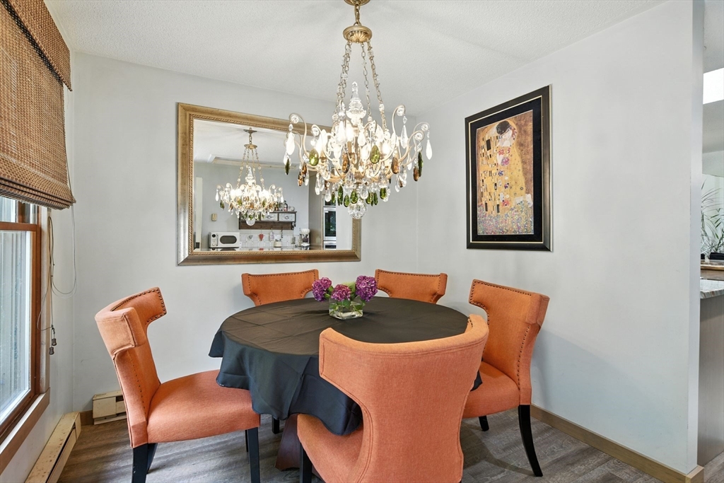 68 Stagecoach Road West Brookfield, MA 01585 - Photo 4 of 40 a dining room with furniture a potted plant and a chandelier