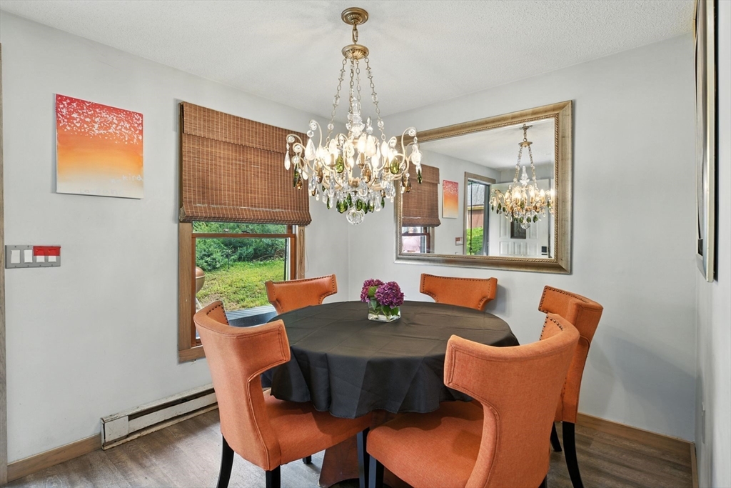 68 Stagecoach Road West Brookfield, MA 01585 - Photo 5 of 40 a dining room with furniture a large window and wooden floor