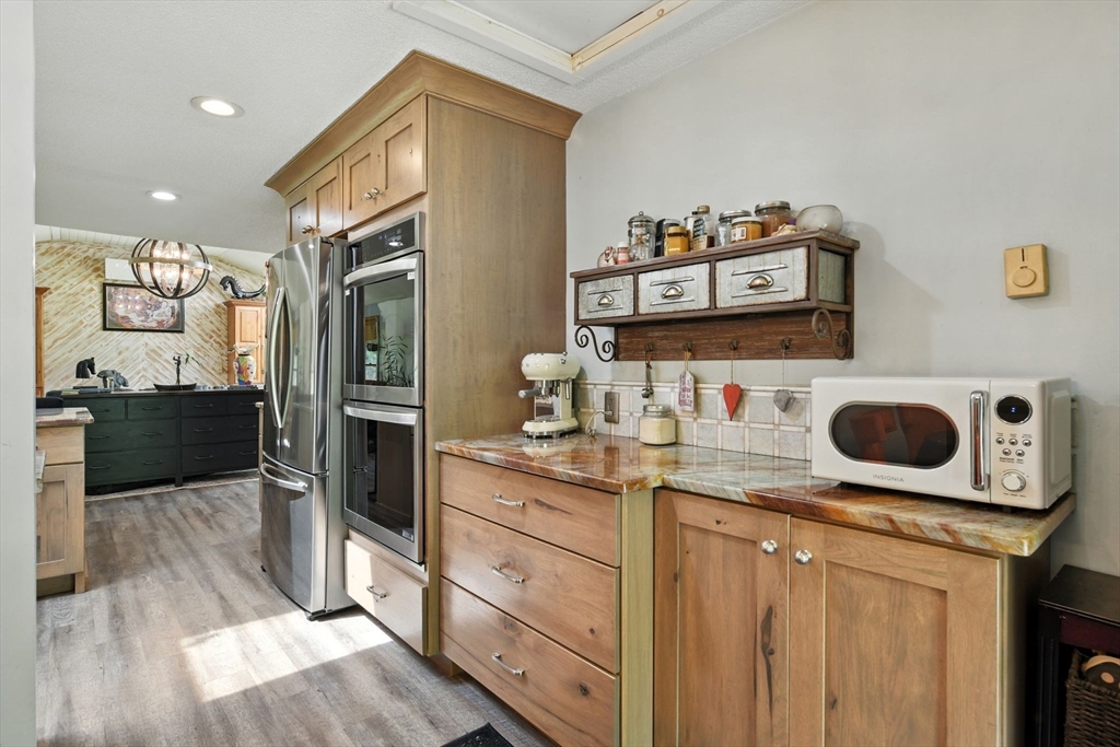 68 Stagecoach Road West Brookfield, MA 01585 - Photo 7 of 40 a kitchen with a stove and a refrigerator