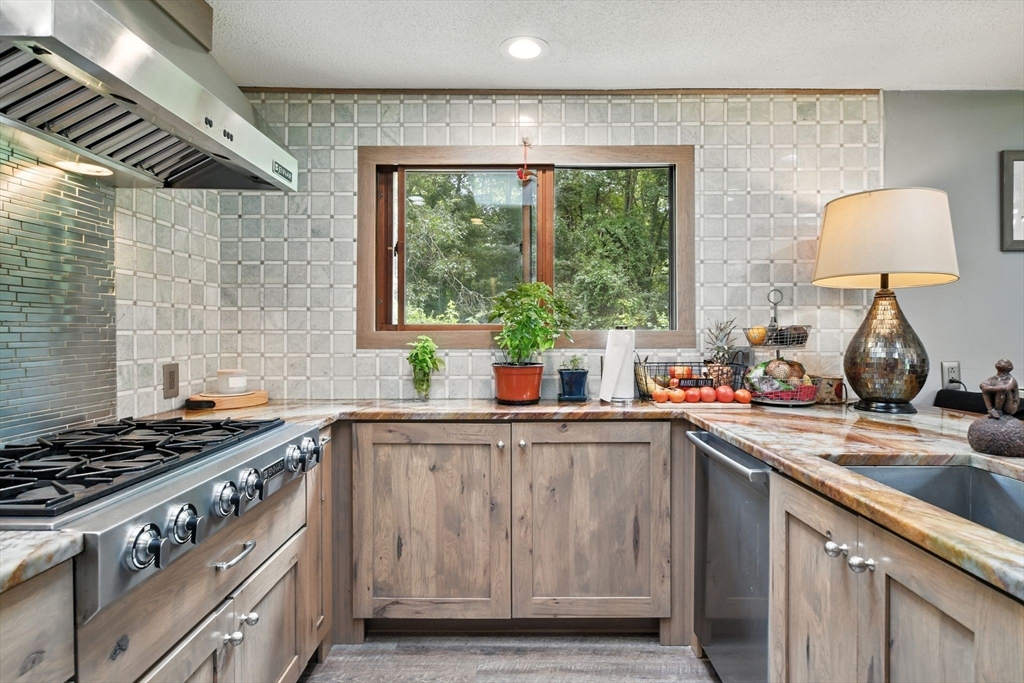 68 Stagecoach Road West Brookfield, MA 01585 - Photo 9 of 40 a kitchen with a stove a sink and a window