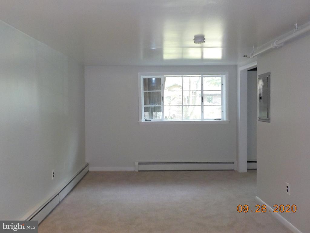 1807 Millers Road, Unit B Wilmington, DE 19810 - Photo 6 of 7 an empty room with a window