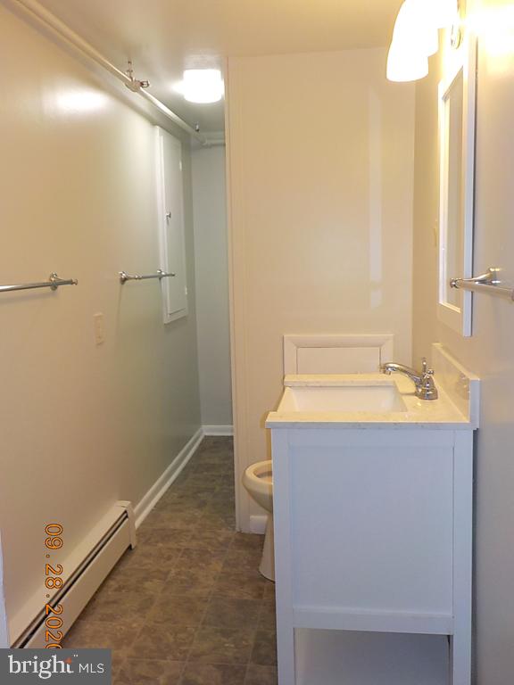 1807 Millers Road, Unit B Wilmington, DE 19810 - Photo 7 of 7 a bathroom with a sink a toilet and shower