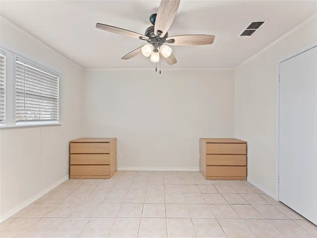 a room with couch and ceiling fan