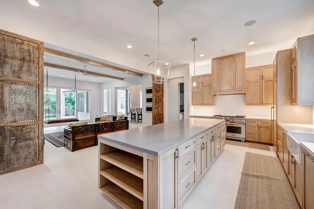 a view of a kitchen with wooden cabinet