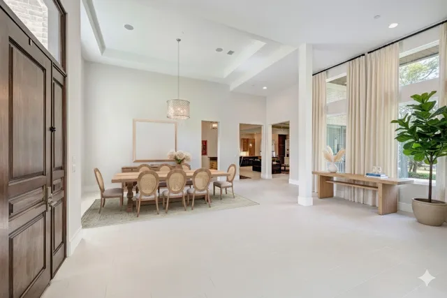 a large kitchen with kitchen island granite countertop a sink and cabinets