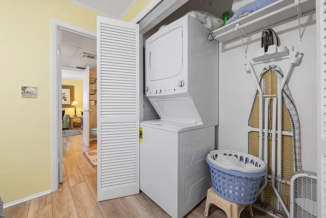 a hallway with a washer and dryer