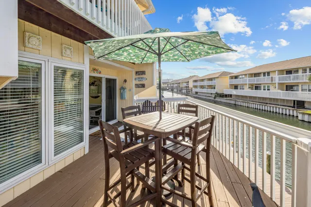 a table and chairs in patio of the house
