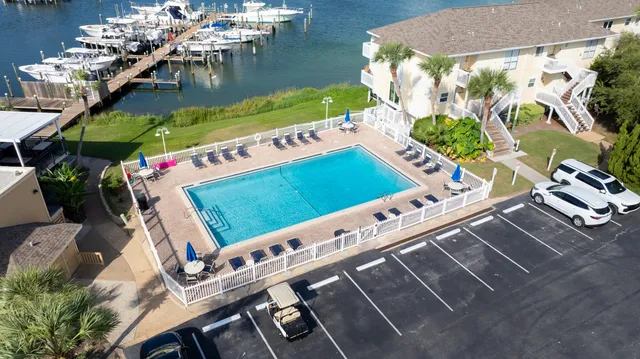 an aerial view of a pool table and chairs