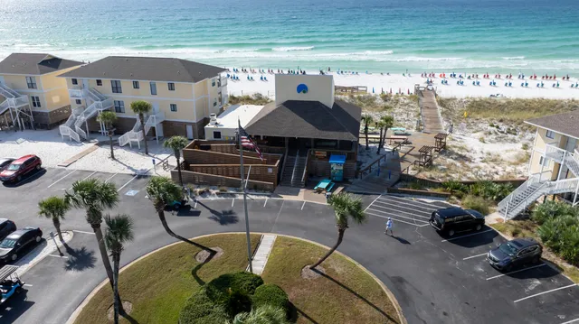 a view of a chairs and table in patio