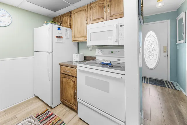 a kitchen with stainless steel appliances a refrigerator sink and cabinets