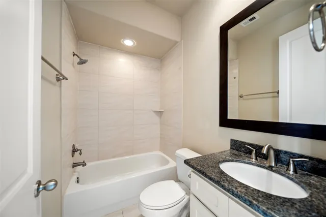a kitchen with kitchen island granite countertop a sink window and refrigerator