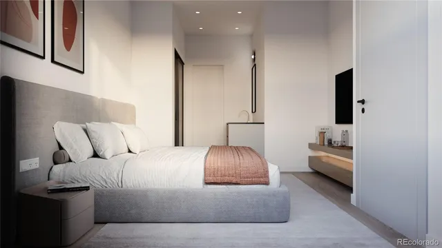 a kitchen with stainless steel appliances granite countertop a sink a stove a refrigerator and island with wooden floor