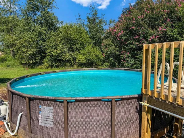 an aerial view of a house with yard swimming pool and outdoor seating